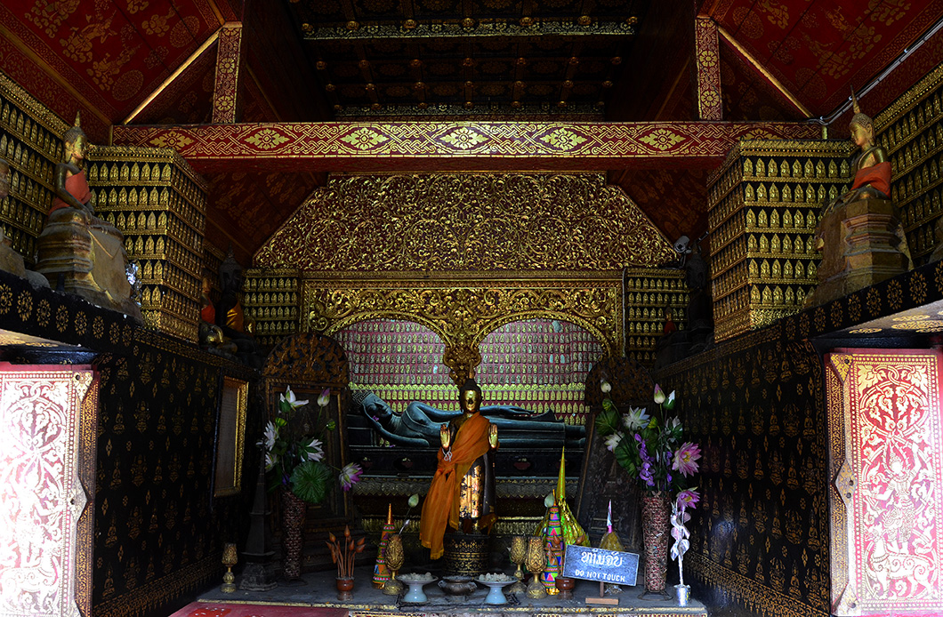 Ancient bronze reclining Buddha in the Chapel Rouge