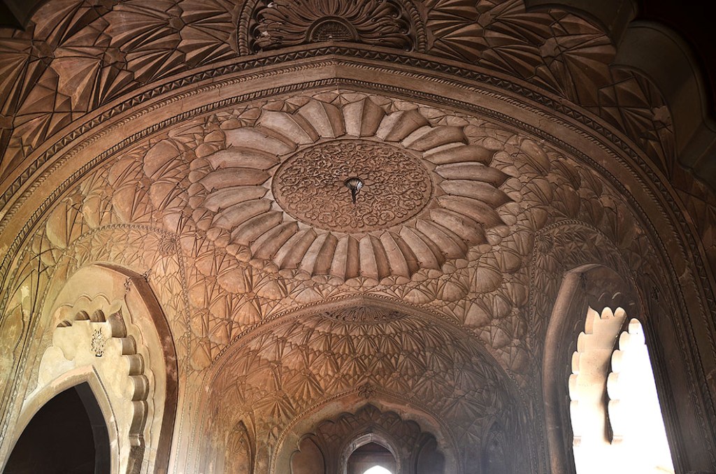 Wide view of interior arches and plaster detailing on ceiling