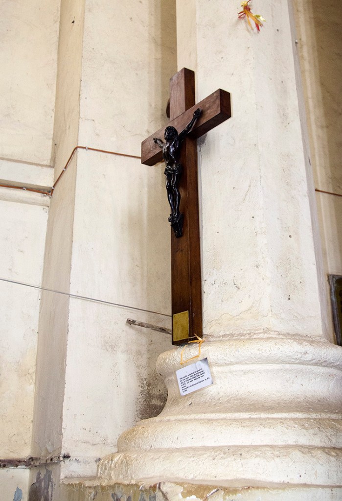 The cross said to be carved out of wood from the tree under 