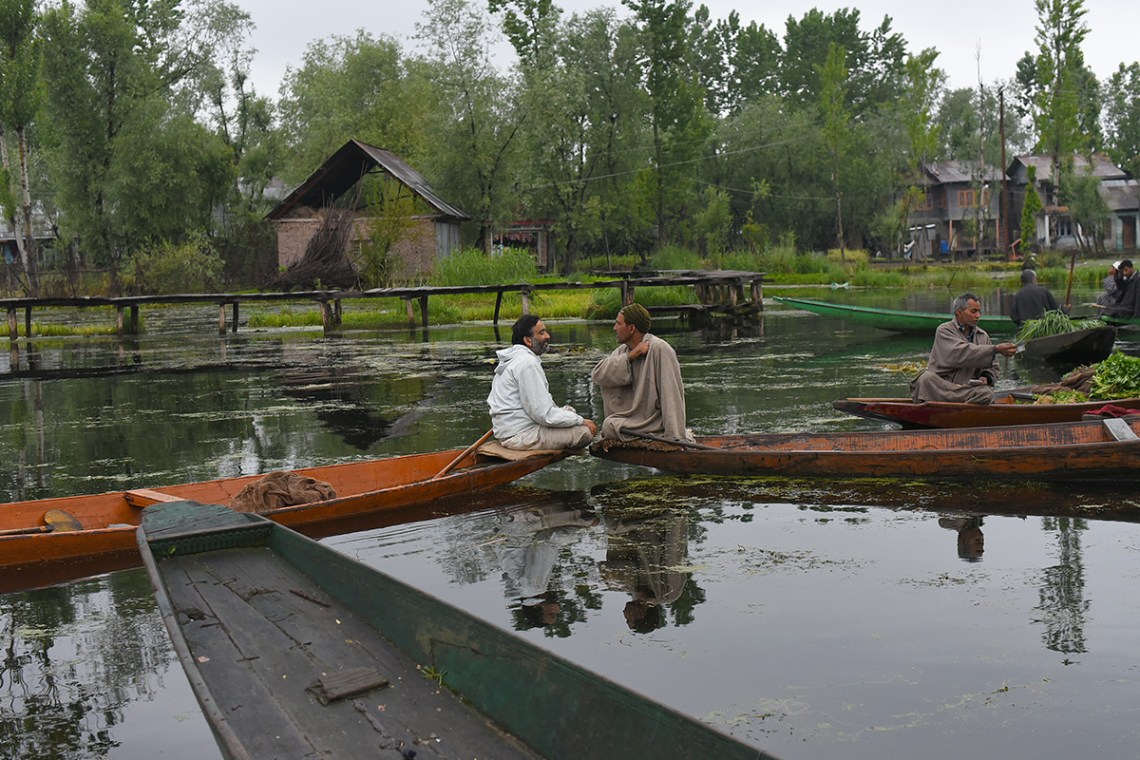 Friends at the floating vegetable market.