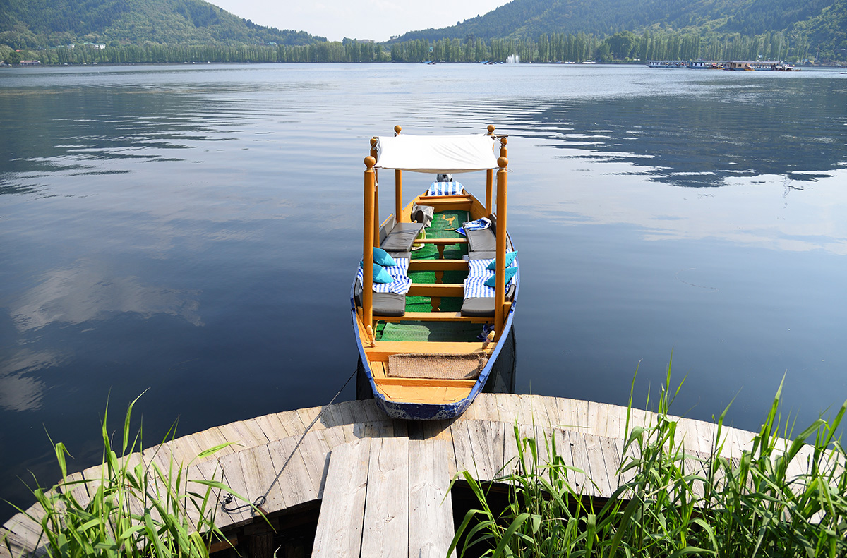 Transfer boat moored at timber dock on Sukoon
