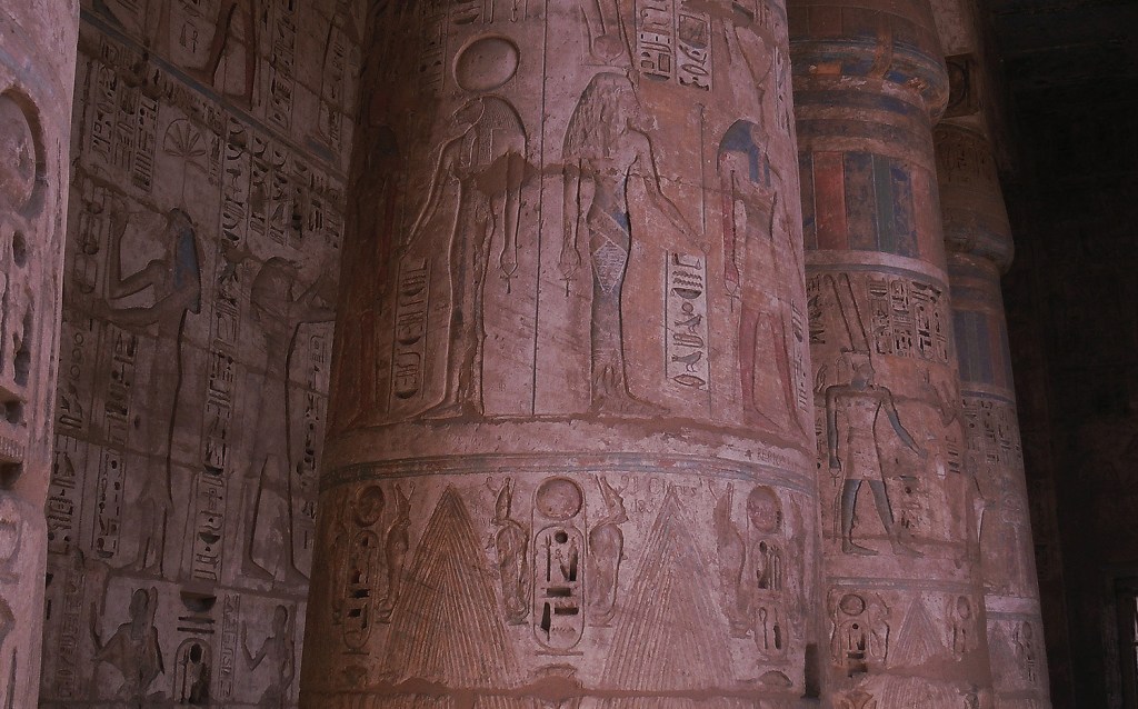 Row of columns with carved reliefs in Medinet Habu.