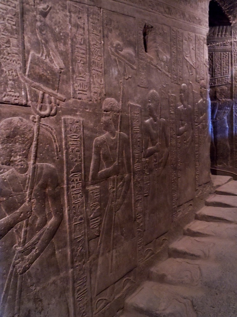 Relief of priests descending the procession staircase.
