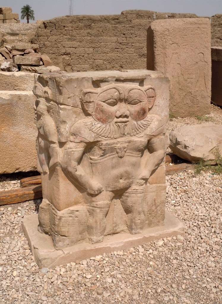 Raised relief of the dwarf god Bes, the patron of childbirth, near the entrance to the Temple of Hathor.
