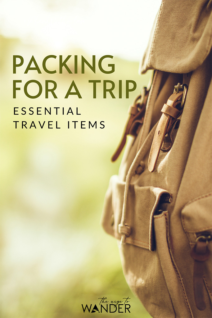 Brown canvas backpack. What's in our travel bags? Here's the complete checklist of our essentials travel items including electronics and photography gear. #PackingList #TravelGear
