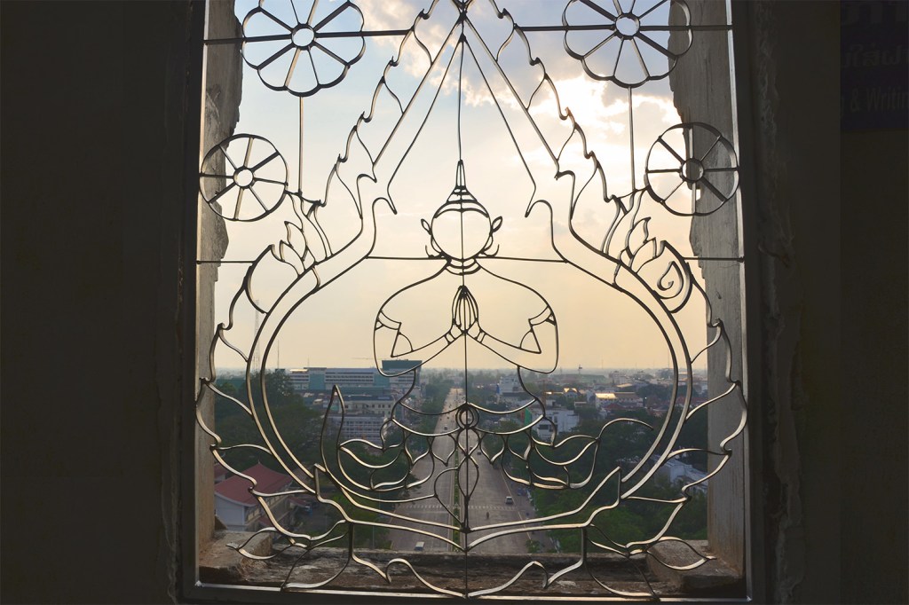 Metal window grill in the shape of the Buddha in the upper level of Patuxai - Vientiane